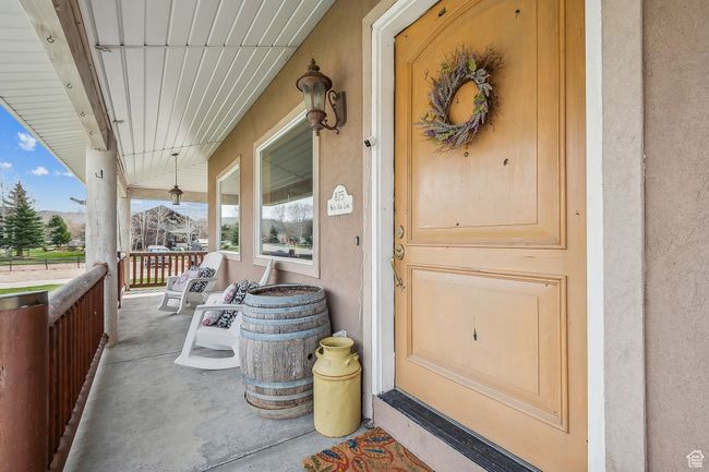 Property entrance featuring covered porch | Image 7