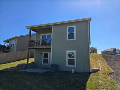 Rear view of house featuring a patio, cooling unit, and a lawn | Image 3