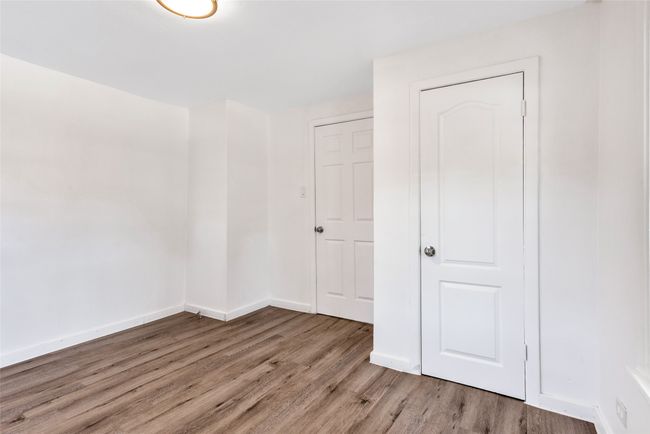 Spare room with light wood finished floors and baseboards | Image 16