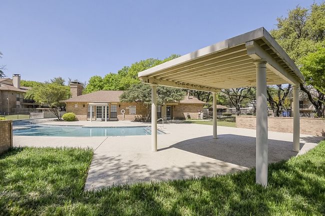 Outdoor pool featuring a patio area and fence | Image 27