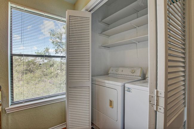 Laundry area located in the kitchen | Image 26
