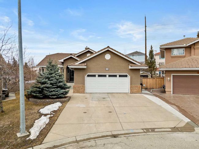 755 Hawkside Mews Nw, Home with 4 bedrooms, 3 bathrooms and 4 parking in Calgary AB | Image 1