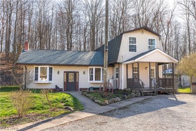 View of front of home with covered porch | Image 1