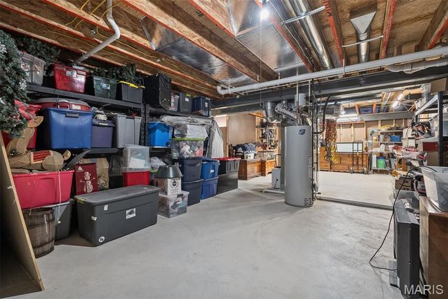 Unfinished below grade area with water heater | Image 30