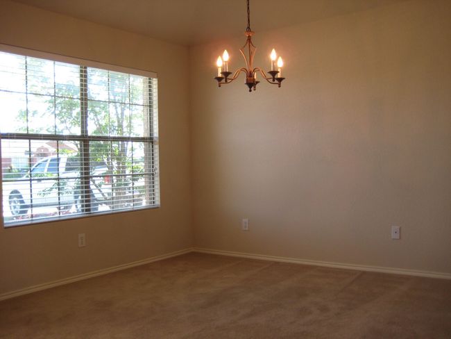 Spare room featuring a chandelier and carpet | Image 8