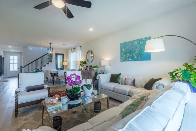 Living area featuring stairs, wood finished floors, recessed lighting, and a ceiling fan | Image 14