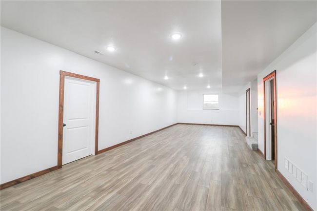 Spare room with light hardwood / wood-style flooring | Image 39