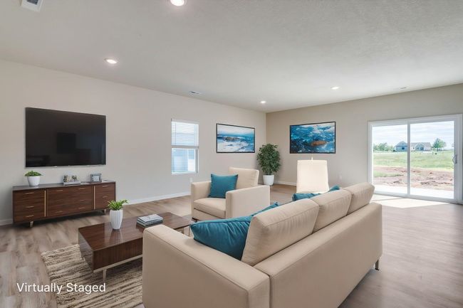 Living room with LVP floors and recessed lighting | Image 20