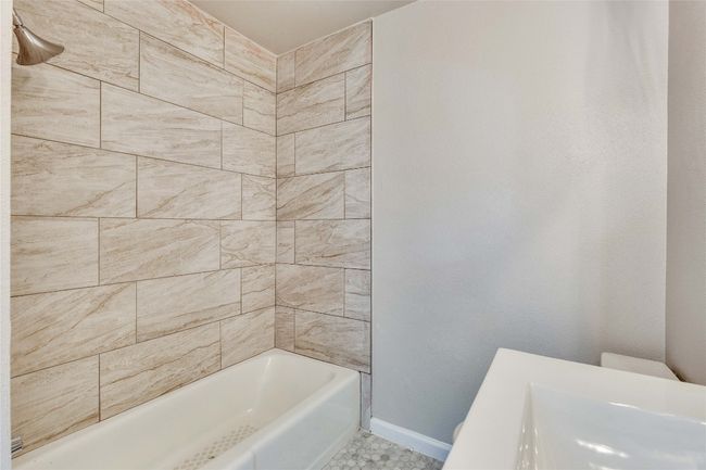 Primary Bathroom attached to primary bedroom with updated shower, light fixtures and vanity. | Image 22