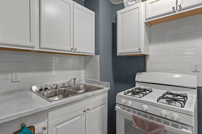 A different perspective of the kitchen. | Image 5