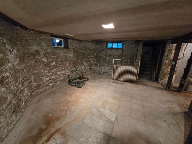 Unfinished basement-stone foundation-has sump pump | Image 44