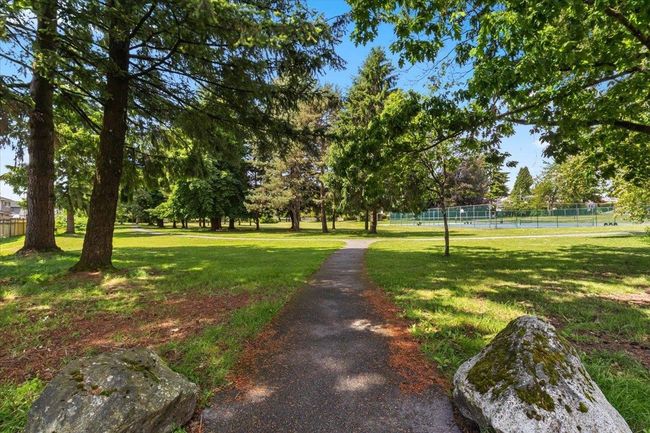 Surrounding community featuring a yard and fence | Image 38
