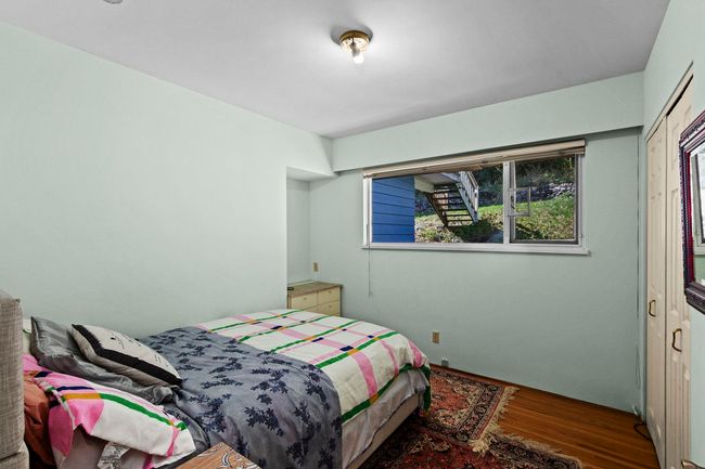 Bedroom with wood finished floors | Image 16