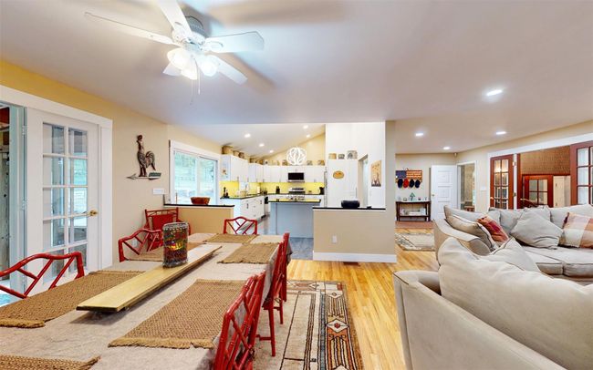 Dining room with light wood-type flooring, ceiling fan, recessed lighting, and vaulted ceiling | Image 12