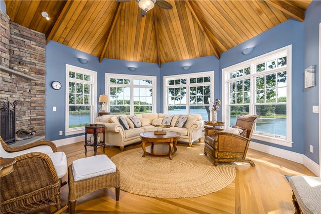 There are beautiful views through these windows and a door to the deck. | Image 19
