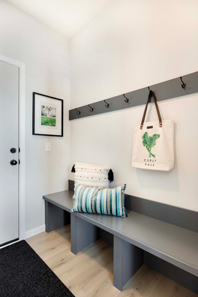 Mudroom located off three car garage includes large boot bench plus walk-in coat closet. | Image 8