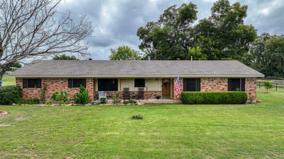 Single story home featuring a porch and a front lawn | Image 3