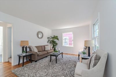 Living room has lots of natural light with beautiful hardwood floors! | Image 2