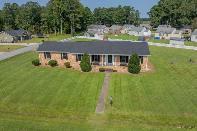 View of front of house featuring a front lawn and covered porch | Image 38