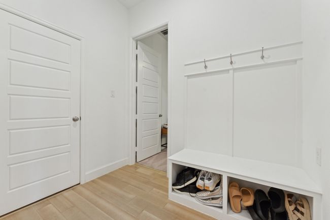 Mudroom featuring light wood-type flooring and baseboards | Image 33