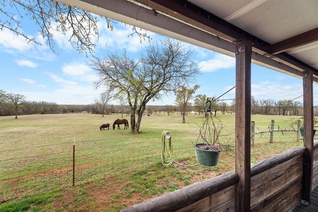 View of yard with fence and a rural view | Image 13