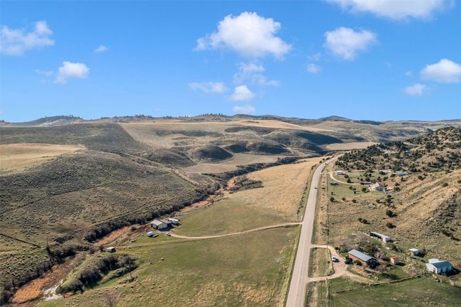 Aerial view of property and surrounding area with rural landscape and a mountain backdrop | Image 8