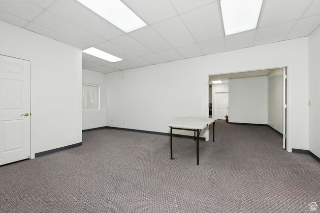 Carpeted spare room with a paneled ceiling | Image 16