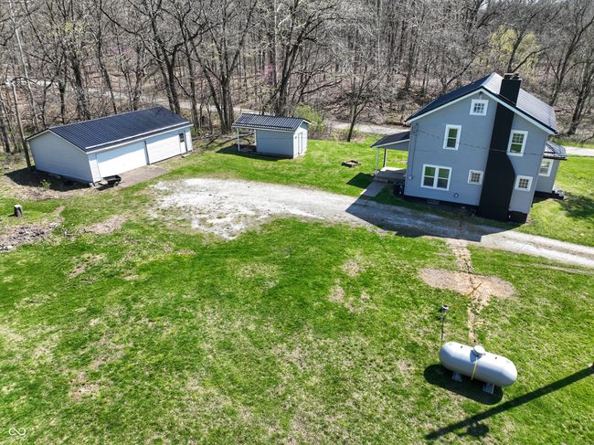 view of yard featuring an outbuilding and a garage | Image 13