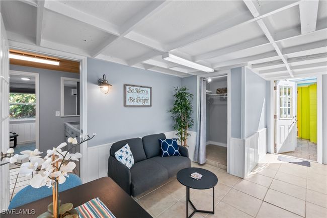 Tiled living room with coffered ceiling and beamed ceiling | Image 25