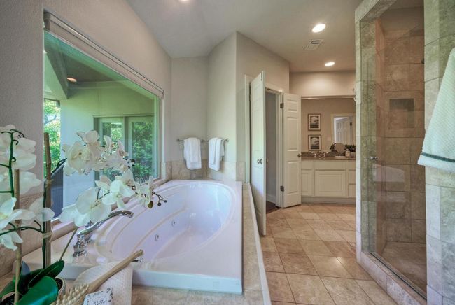 Primary full bath featuring recessed lighting, tile floors, jacuzzi tub | Image 24