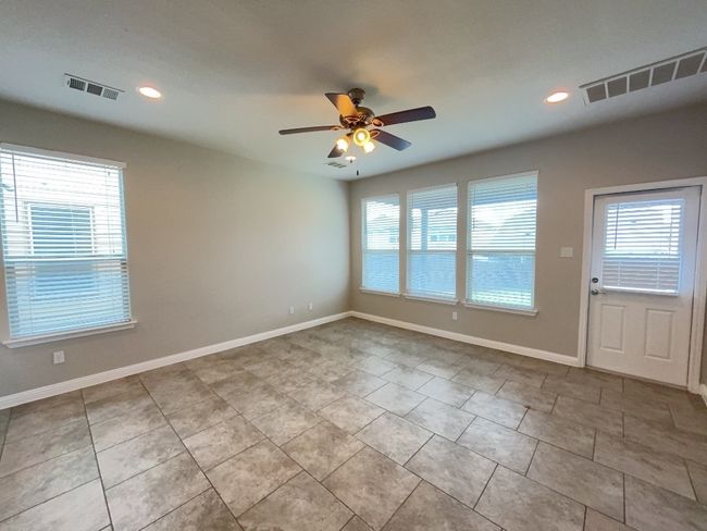 Dinging and Living room with a ceiling fan, tile patterned flooring, and recessed lighting | Image 9