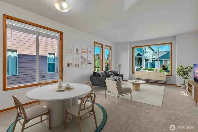 Virtually staged dining and living area. | Image 8