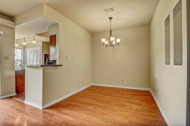 Dining room with chandelier. Could also be used as an office or flex space | Image 16
