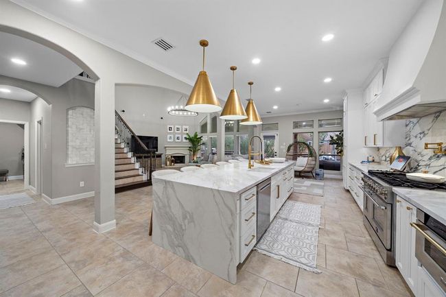 This masterpiece boasts soaring ceilings, open-concept design, and top-tier affiant finishes | Image 12