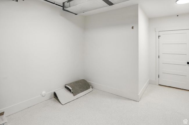 Spacious closet with light carpet | Image 48