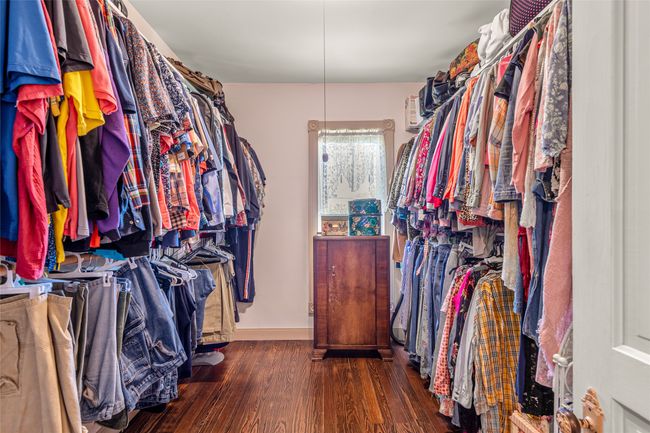 Walk in closet with wood finished floors | Image 29