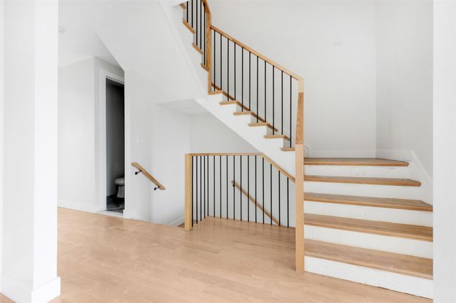 Stairs with hardwood / wood-style floors | Image 17