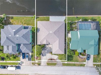 The home has a new roof (2023) and 75' of lakefront with a cement sea wall. | Image 3