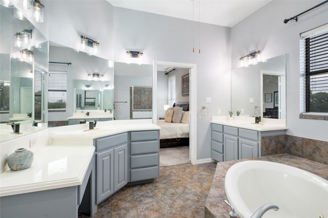 Full bath with two vanities, a bath, and connected bathroom | Image 24