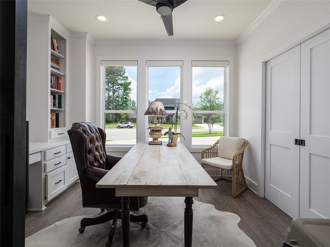 Office with healthy amount of natural light, crown molding, ceiling fan, dark wood-type flooring, and recessed lighting | Image 15