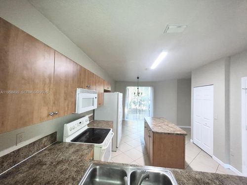 1909-1909 Hibiscus Ln, Riviera Beach, FL, 33404-1872 | Card Image