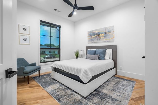 Bedroom featuring baseboards, light wood-style floors, and a ceiling fan | Image 21