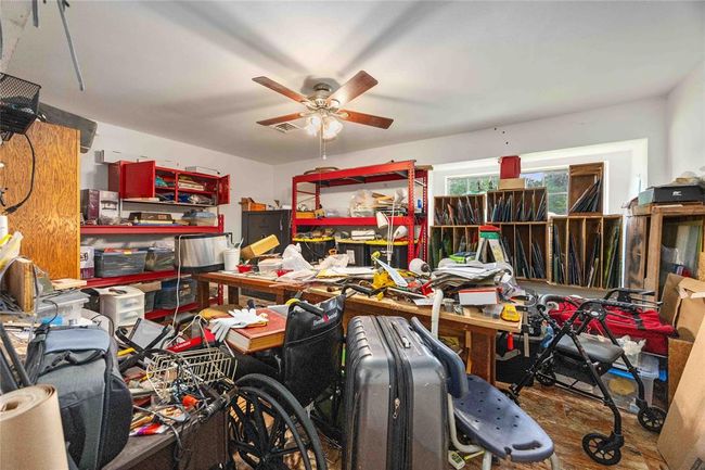 This room was used for crafts. It is the 2nd downstairs bedroom and offers a large walk in closet. | Image 16