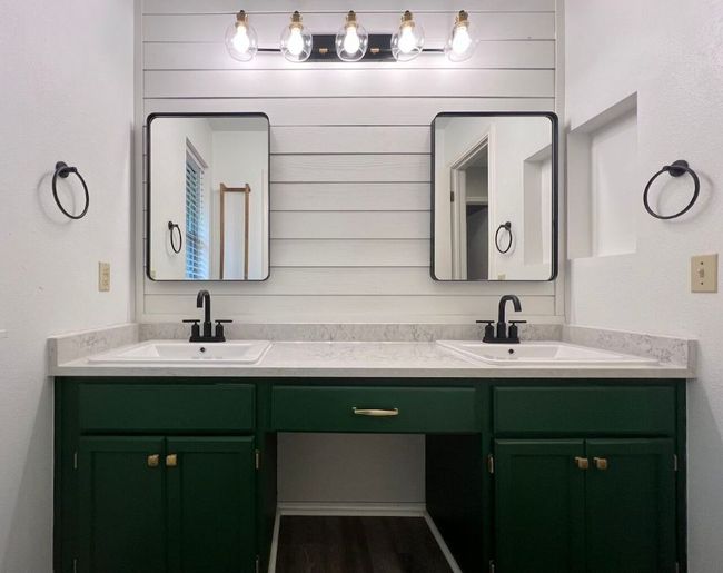 Bathroom featuring double vanity, dark wood-type flooring, and wooden walls | Image 30