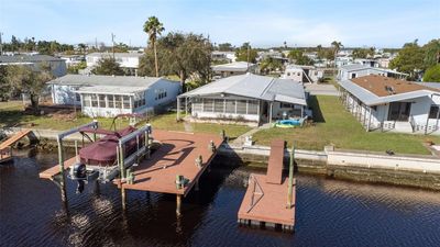 Look at this boat lift, dock and floating dock! Gorgeous! | Image 1