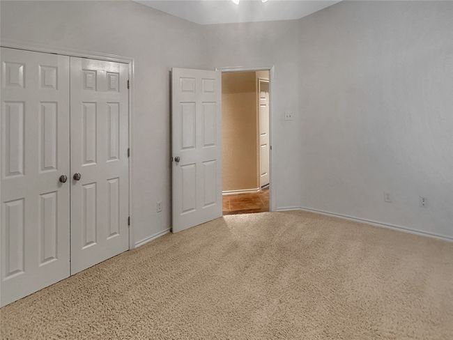 Unfurnished bedroom with carpet floors, baseboards, and a​​‌​​​​‌​​‌‌​‌‌​​​‌‌​​‌‌​‌​​​​​‌ closet | Image 12