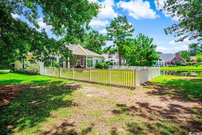 View of yard featuring a sunroom and a water view | Image 31