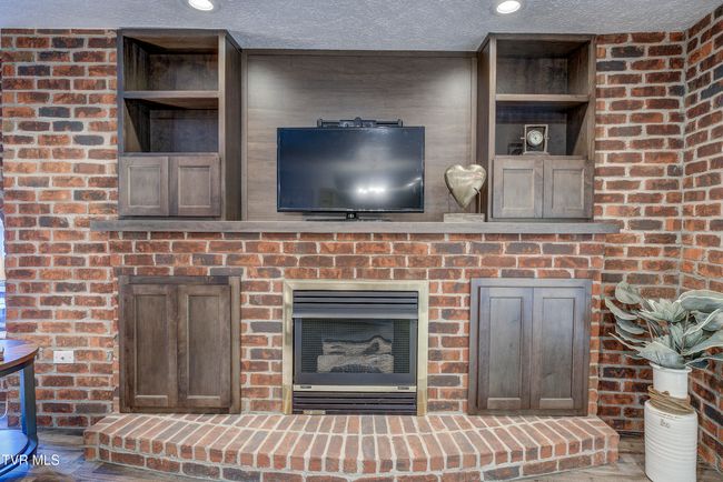 Gas Fireplace w/custom solid wood storage cabinets | Image 11