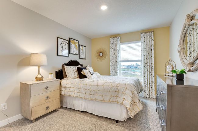In addition to the primary bedroom, the home's upper level also includes these two additional bedrooms, and another full bathroom just adjacent to each! Photo of model, colors and options will vary. | Image 18