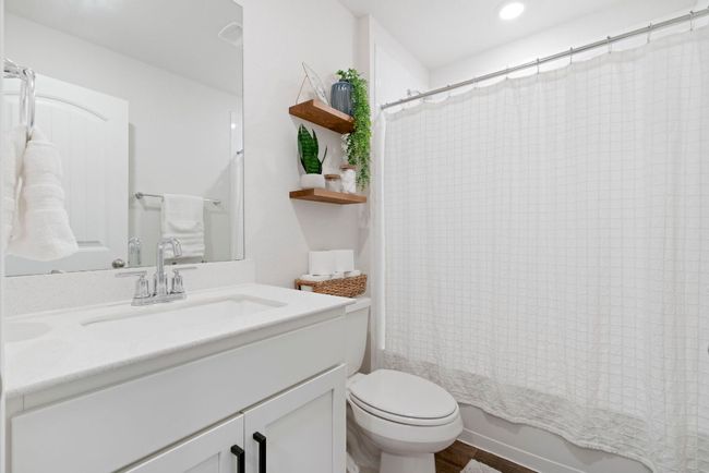 Bathroom with vanity, shower / bath combo with shower curtain, and recessed lighting | Image 26